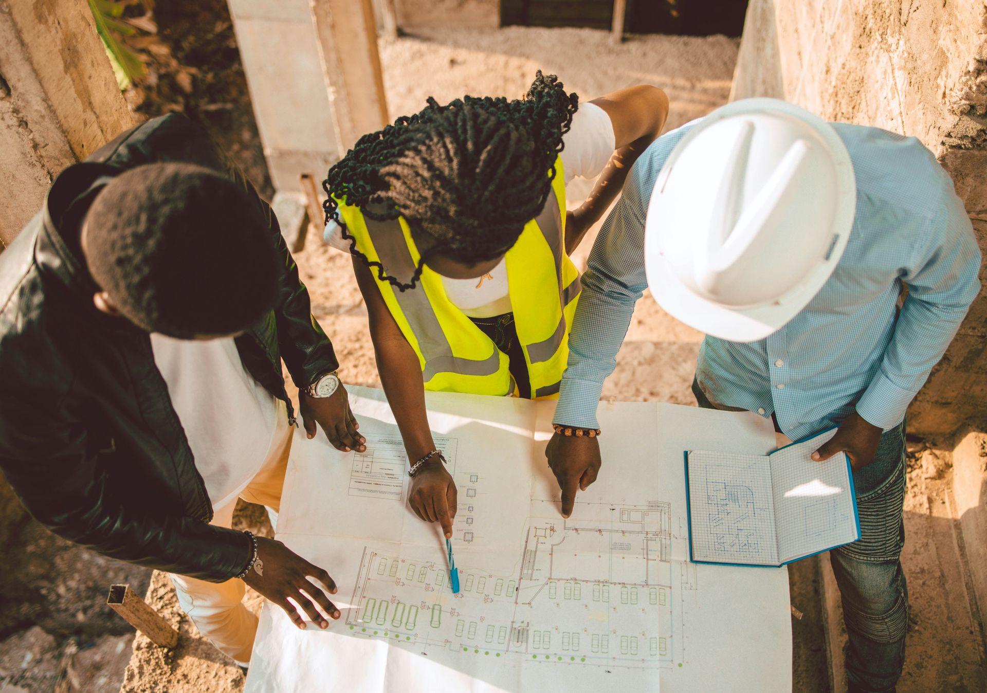 Construction project planning with blueprints and scheduling chart