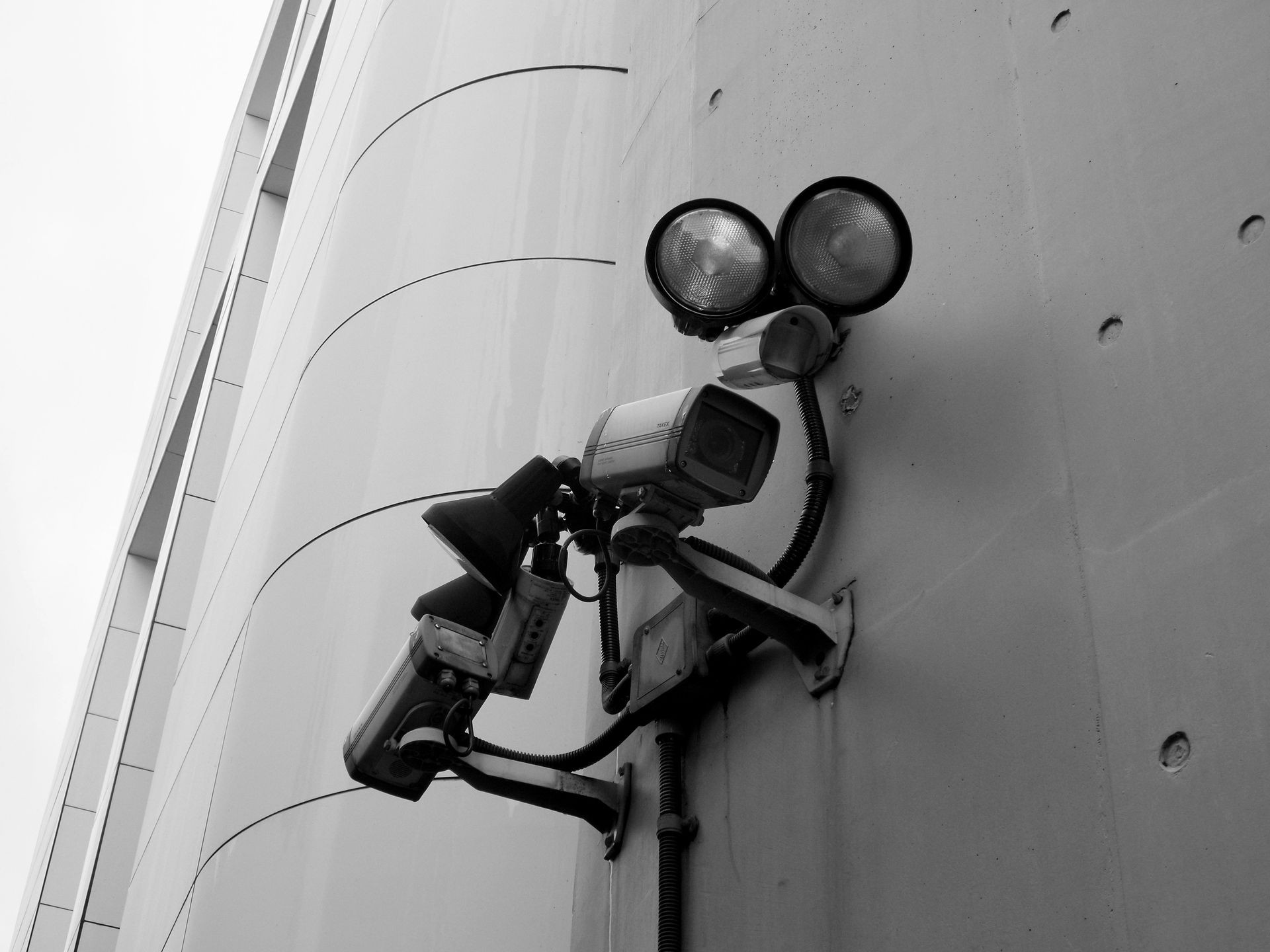 Home security camera installation by professional technician.